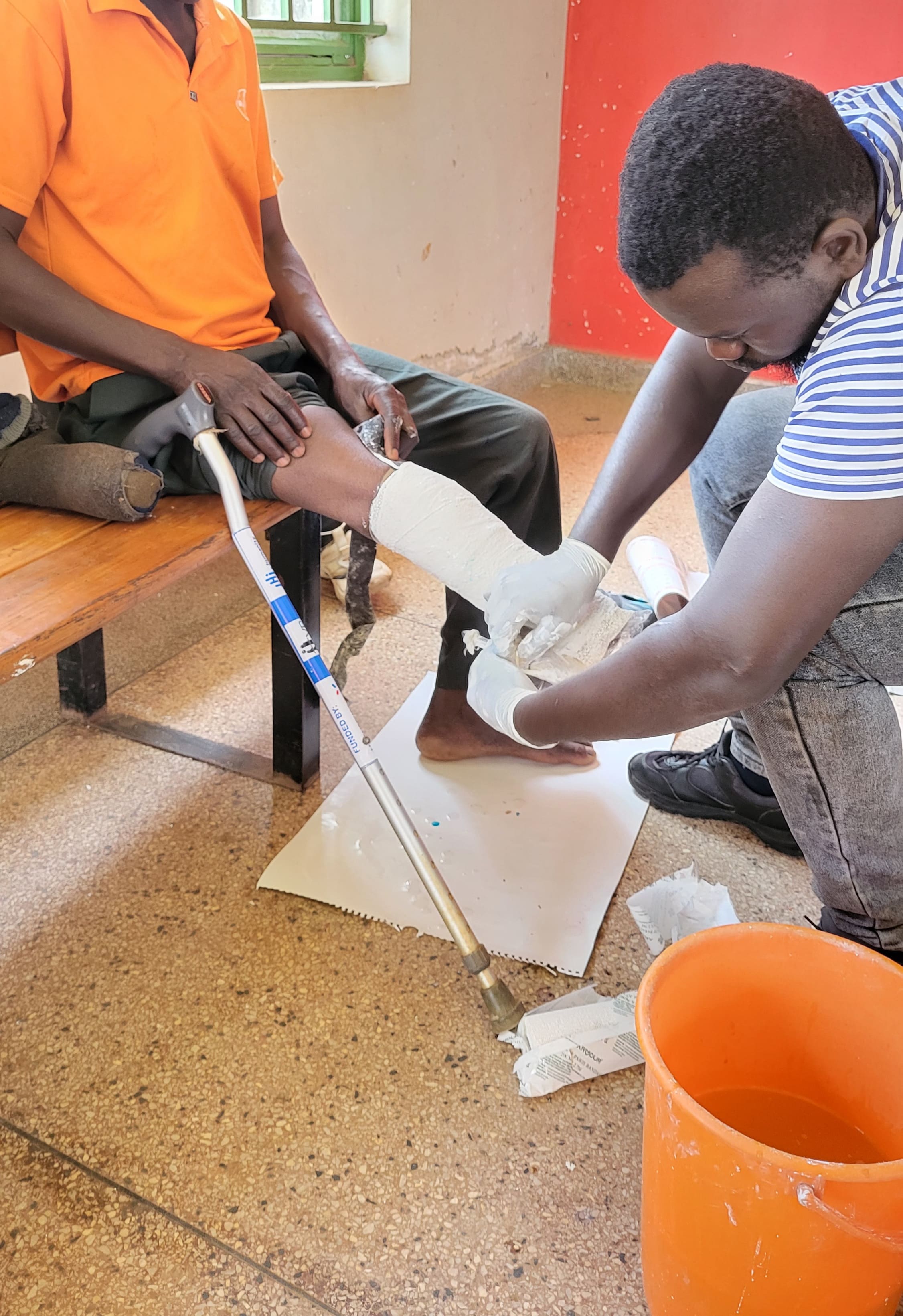 orthopeadic technologist applying a  cast after measurements